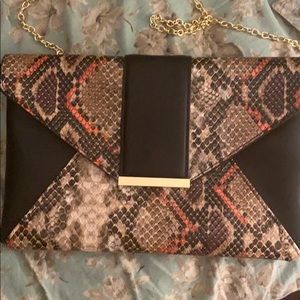 Faux snakeskin clutch